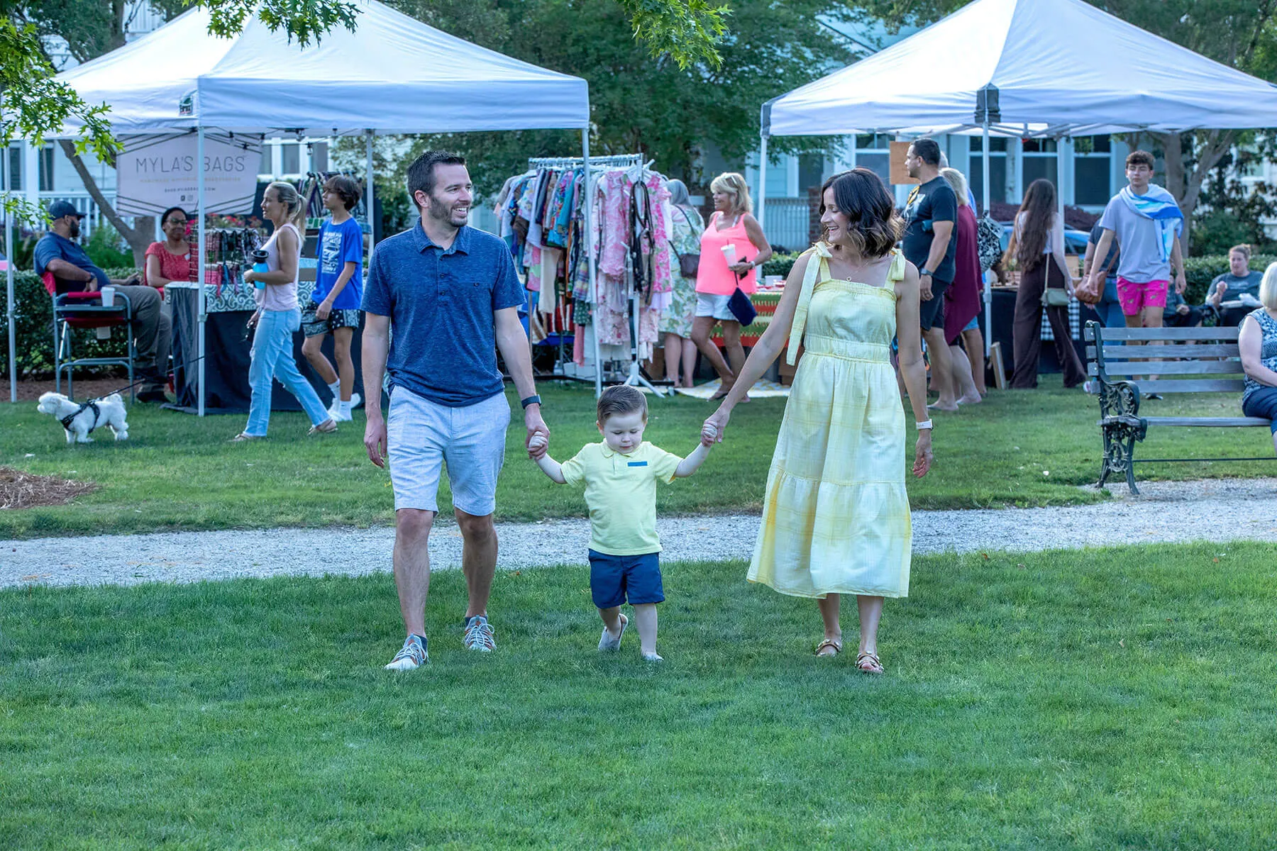 Couple walking their toddler in the Farmers Market